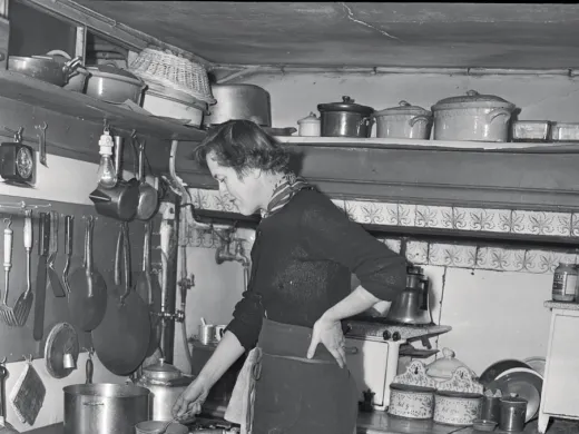 Child in her postwar Paris kitchen