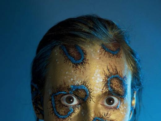 Shelby Meyerhoff's photographic self-portrait of her head and shoulders transformed with body paints into a blue-ringed octopus