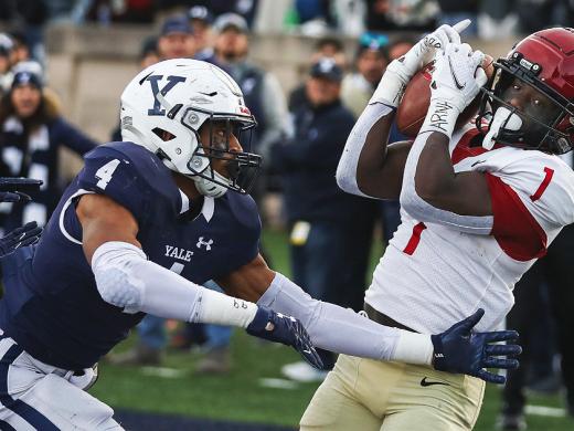 Wideout Kym Wimberly hauls in Luke Emge’s third-down, last-seconds, no-timeouts pass to secure Harvard’s thrilling 31-27 victory in The Game. 