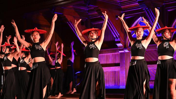 Students performing dance on stage