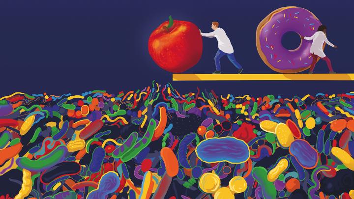 Illustration of an apple being pushed from a platform into a sea of colorful microbes