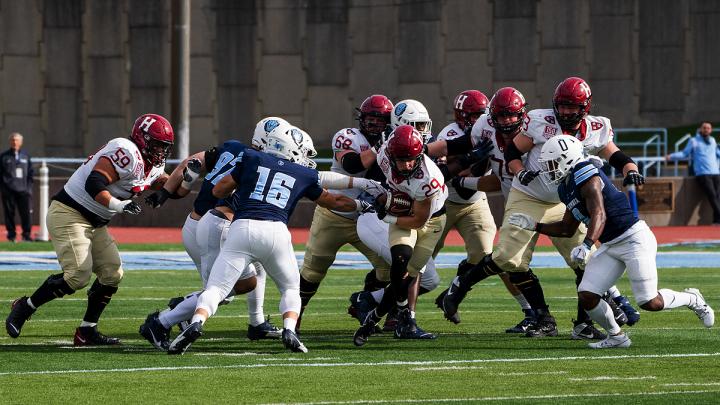 Harvard offense has the ball with Columbia defense in pursuit