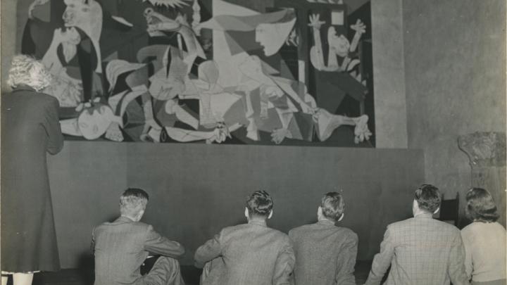 Seated students with Pablo Picasso's "Guernica" in 1941 