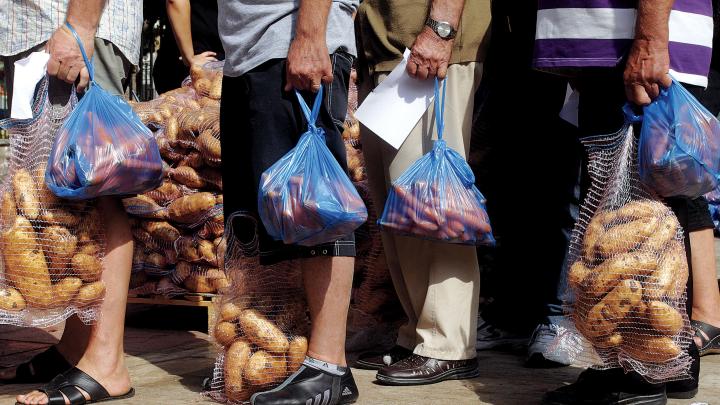 Hunger stalks southern Europe: A nationalist political party distributes food in Athens, September 14, 2012. 