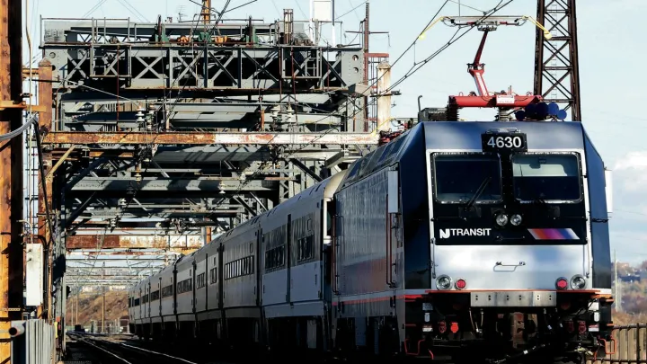 A New Jersey Transit train crosses a 1910 bridge in Kearney, N.J., over which 150,000 to 200,000 passengers cross daily&mdash;making it perhaps the busiest rail span in the Western Hemisphere. It is obsolete, but a $940-million plan to replace it remains unfunded. 