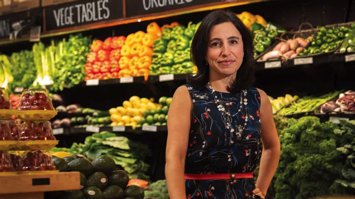 Emily Broad Leib in front of produce 
