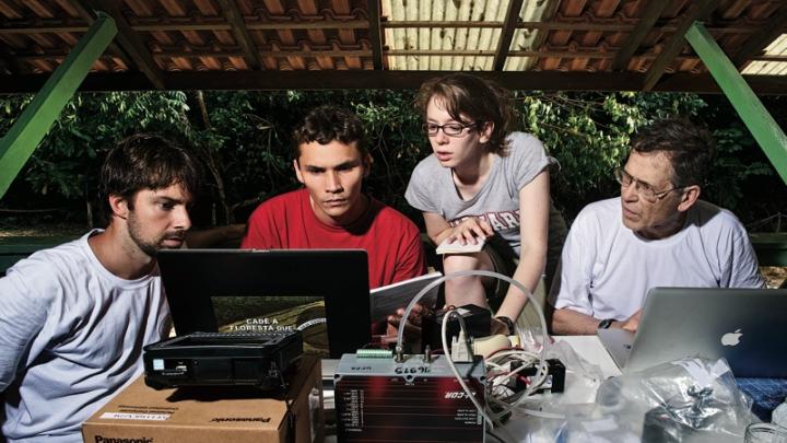 Bernardo Flores, Rafael  Tapajós, and Hannah Horowitz ’11 learn how to analyze data  gathered from a weather balloon under the supervision of  Professor Steven Wofsy