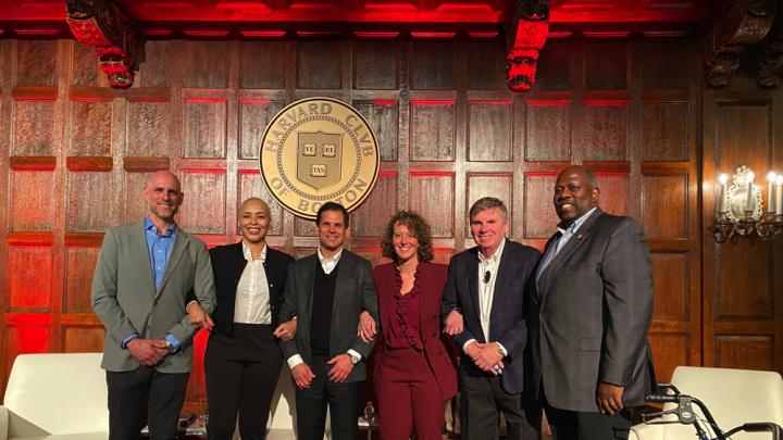 The "Fab Five of Harvard Sports" panelists: (left to right) Ben Crockett ’02, Allison Feaster ’98, Don Sweeney ’88, and Jessica Gelman ’97, M.B.A. ’02, alongside Harvard Club president Marcus O.P. DeFlorimonte PMD '95.