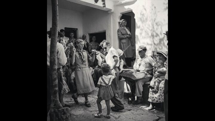 crowd of people dancing on Mykonos in 1955