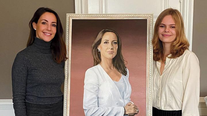 Princess Marie and Jensen pose beside Jensen's finished portrait of the princess 