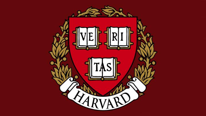 Harvard shield on red background