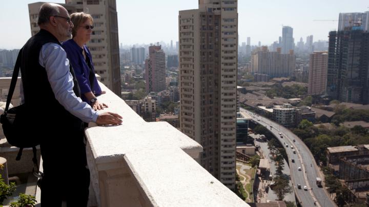President Faust and Rahul Mehrotra, chair of the Graduate School of Design’s department of urban planning and design, look out over Mumbai.