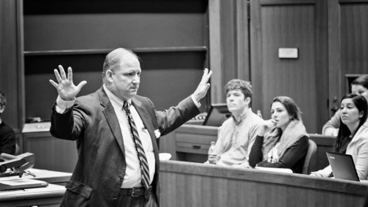 Michael Spalter, M.B.A ’93, addresses a crowd in Aldrich Hall.