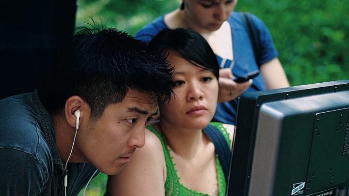 Louie and director Tze Chun check a monitor during production.