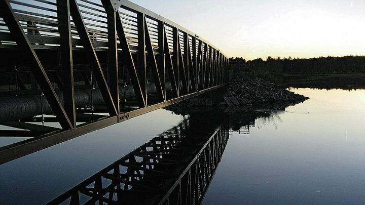 The Eastern Trail’s bike and pedestrian bridge respects the animal and bird life of the marshlands in Scarborough, Maine.