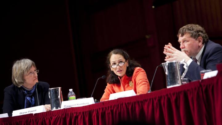 President Drew Faust moderates a February 22 discussion of the human genome map's impact in the 10 years since its first publication. Also shown are panelists Margaret Hamburg ’77, M.D. ’83, commissioner of the U.S. Food and Drug Administration, and Eric Lander, president and founding director of the Broad Institute of Harvard and MIT and professor of systems biology at Harvard Medical School.