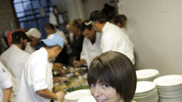 Too many cooks  in the kitchen? Not for LaRochelle and her staff, who are preparing citrus-marinated grilled mojo chicken with apple-raisin chutney for a wedding banquet. 