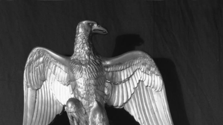 Finial in the form of an eagle. Gilt metal (bronze), French, 1813–1814, approximately 10 inches high. This originally sat on the top of the pole support of a silk Napoleonic flag in the Short Gallery. The flag was not taken by the thieves. The finial is made of bronze, but may have had the appearance of gold to the thieves.