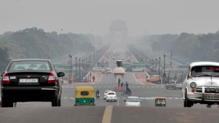 The <em>Rajpath,</em> or King’s Way, in New Delhi runs from the federal government complex to the India Gate monument (seen through morning fog in the distance). It is the route for the annual Republic Day parade.