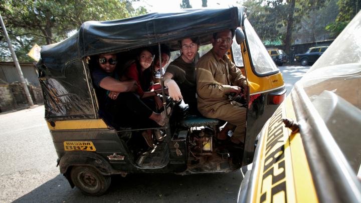 Gitangu, Ayuningtyas, Abdul Rahman, and Potter cram into an auto-rickshaw for the ride back to their hotel at the end of the day.