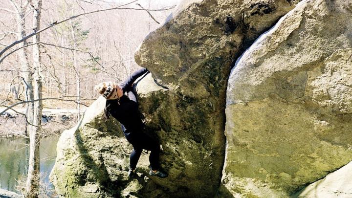 Athena Jiang ’11, of the Harvard Mountaineering Club, takes on “The Wave” while bouldering in Lincoln Woods, near Providence, Rhode Island.