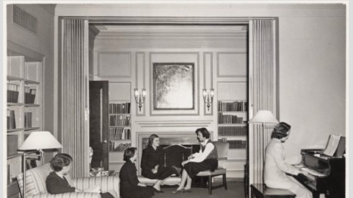 A group of Radcliffe students socialize in a common room in Moors Hall circa 1950. 