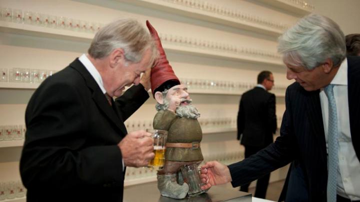 A viewer pumps the headgear of a <i>Pissing Gnome,</i> causing the gnome to urinate beer. 