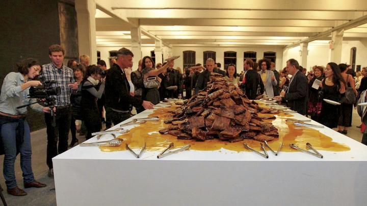 The 2009 event <i>Creation</i> included a ton of barbecued ribs, plus tongs, with honey dripping on them.