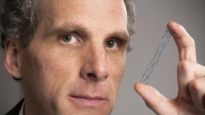 David Jones holds a vascular stent (from the Warren Anatomical Museum), designed circa 1995 by radiologist Morris Simon of Harvard Medical School.