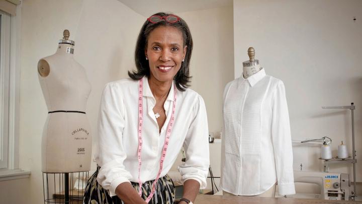 Designer Katiti Kirondé with her white shirts at the Fashion Lab of Fisher College in Boston