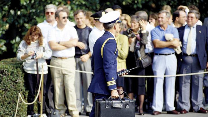 A military aide to President George H.W. Bush carries the &ldquo;nuclear briefcase,&rdquo; cabled to his wrist, in 1991. 