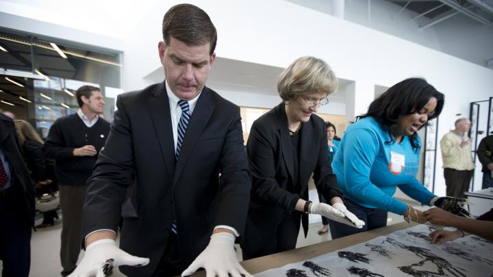 Harvard University president Drew Faust and Boston mayor Martin J. Walsh participate in a community art project at the opening of the Ed Portal’s new building in Allston.
