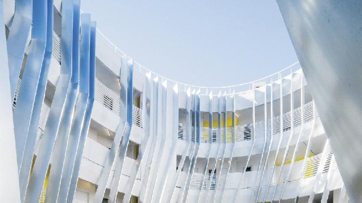 The interior courtyard of the New Carver Apartments offers outdoor space isolated from the sounds of the nearby freeway.