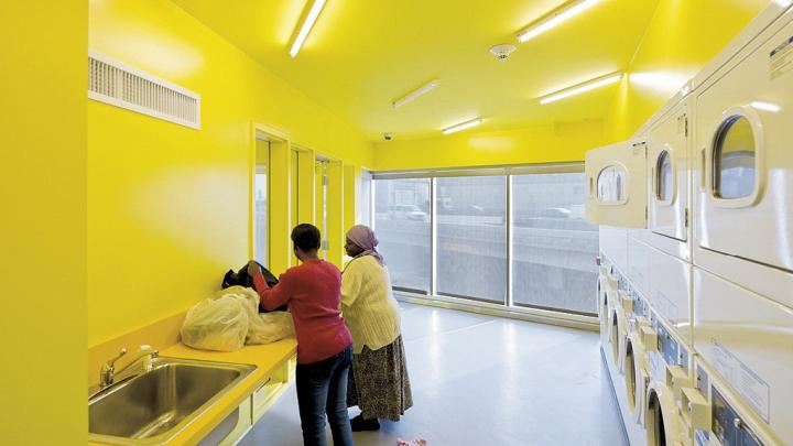 A laundry room in the New Carver Apartments