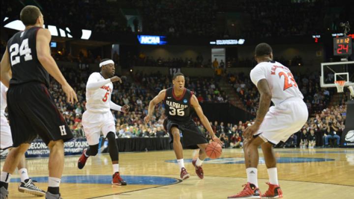 In the NCAA basketball tourney, Agunwa Okolie handles the ball for Harvard. The Crimson will face Michigan State on March 22.