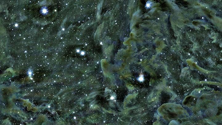 Part of the Perseus molecular cloud, as seen through the Smithsonian’s MMT telescope in Arizona. Self-gravitating structures—dense areas where stars are forming—appear as dark spots. The L1448 region is located in the upper-right quadrant of the image.