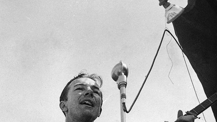 Pete Seeger, shown singing in an undated photo, traveled light, always ready to make music.