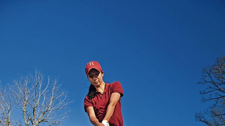 At the Fresh Pond Golf Course in  Cambridge, Emily Balmert ’09 of the women’s golf team—the first Harvard woman to win the Ivy championship—swings into spring.