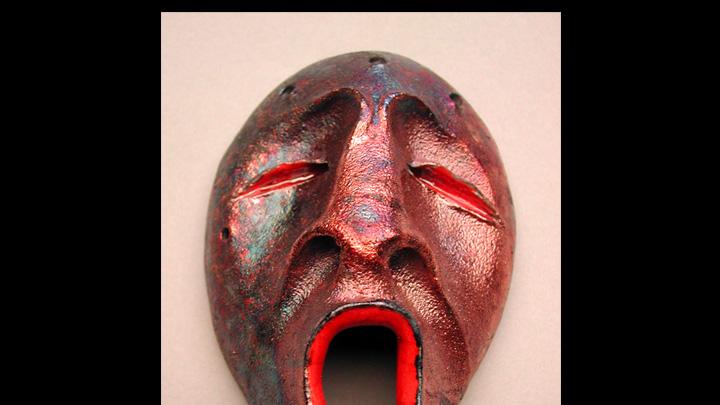The mask shows the metallic effect produced by raku glazing. The singing spirit, a common motif in Charette’s work, represents a Yup’ik view of the life cycle: as mortals rejoice at a new birth, the spirit world mourns the loss of a friend; when earthly life ends and that spirit rejoins its friends, spirits rejoice as mortals grieve.
