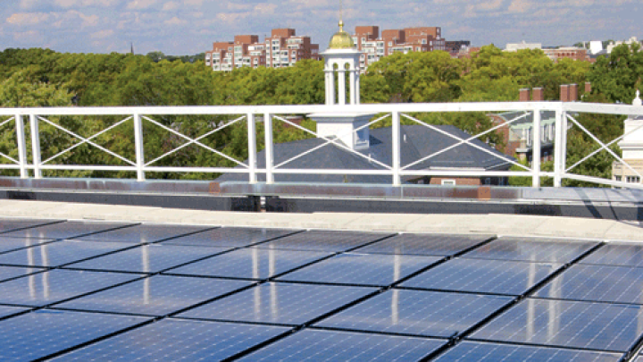 Harvard is already trying many green initiatives; it will need to do much more to meet its new greenhouse-gas emissions goal. Above: solar panels on the roof of the Business School’s Shad Hall.
