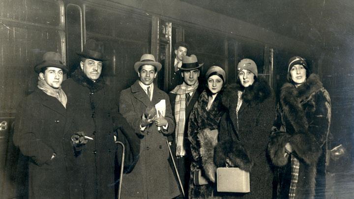 Diaghilev with members of the company, on tour at the train station in Liverpool, England, 1928