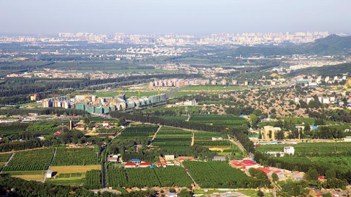 Development sprawls ever-outward from Beijing (in background, right) toward rural Sujiatuo.