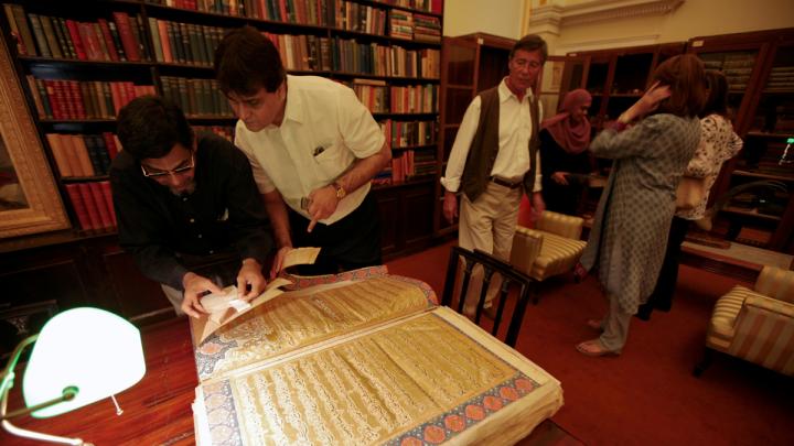 The Chowmahalla's library includes a collection of rare, antique Korans given as gifts to the royal family. (Princess Esra is at right, in blue.)