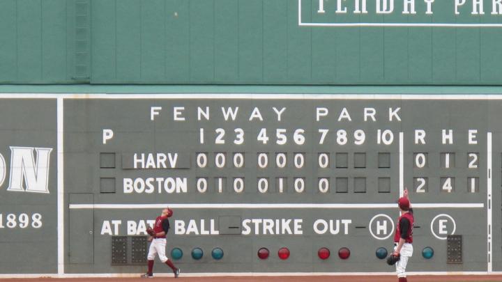 The scoreboard shows the line score of Fenway's first game, on April 9, 1912.