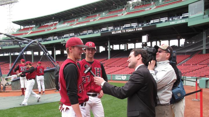 Harvard players are interviewed by a local news station.