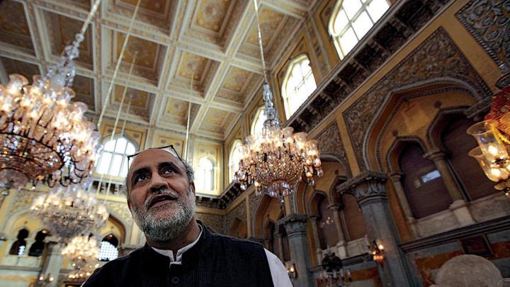 Rahul Mehrotra stands in the <i>darbar,</i> the ceremonial hall where coronations took place.