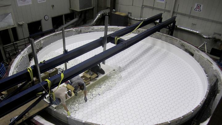 At the Steward Observatory Mirror Lab, in Tucson, staff load the rotary kiln with 20 tons of chunks of borosilicate glass. 