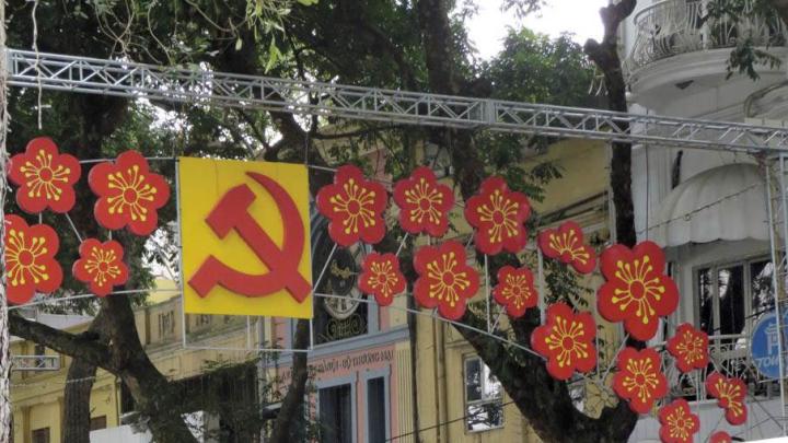 Lest anyone forget, Vietnam remains a Communist Party state, as a street decoration in central Hanoi suggests.