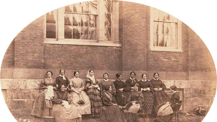 A group portrait of the College housekeepers, then known as “goodies”
