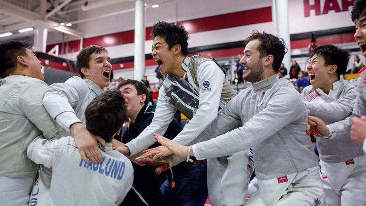 fencers celebrate a championship win